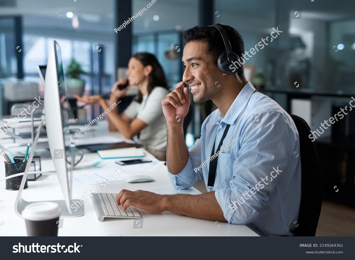 This image has an empty alt attribute; its file name is stock-photo-dedicated-service-creates-dedicated-customers-shot-of-a-young-man-using-a-headset-and-computer-in-2149264361.jpg